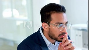 Software engineer thinking of a solution for desktop web operating system. Thoughtful male IT specialist or expert using his problem solving skills to solve and analyze company data management issues