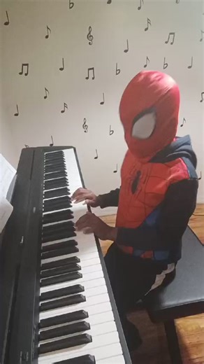 Online student Travoe dressed as Spider-Man playing "Lightly Row" | Western Tutorial Music Studio