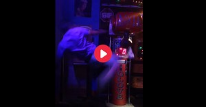 WATCH: Drunk Guy Hilariously Fails at Kicking Arcade Punching Machine
