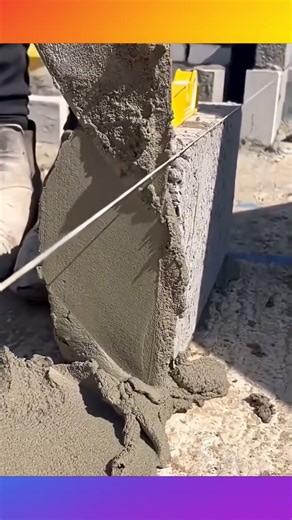 installing concrete stones in making the foundations of a building's walls #contruction #stonework