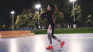 Sportive Curly Girl Stretching Legs And Doing Lunges In The Park At Night | Free Stock Video Footage