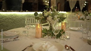 Romantic dinner table on the beach . Table setting at a luxury wedding and Beautiful flowers on the table.