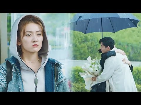 The wife was waiting for her husband in the heavy rain, but saw him embracing another woman.