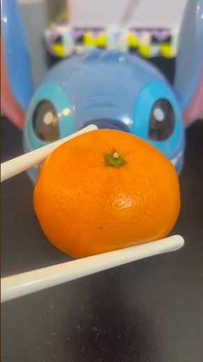 Angry lilo stitch eating small orange #orange #asmrsounds #satisfying #viralshort #shortvideo