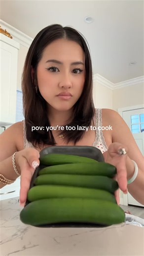 a on Instagram: "4 ingredient cucumber salad 😋 - chicken powder - chili oil - sesame oil - garlic #lazy #cooking #explore"