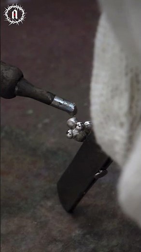 👁️ Beads clustered like alive, eerie, and mesmerizing alien eggs. #studearrings #soldering #labret