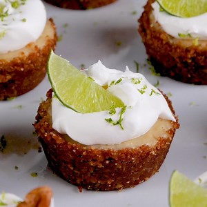 These Pecan Crusted Mini Key Lime Tarts put a nutty twist on a classic recipe. We love the texture and flavor the Fisher Pecans add to the crust, and their mini size makes them a decadent little snack! Get the recipe here: https://bit.ly/2y93MSF | Fisher Nuts