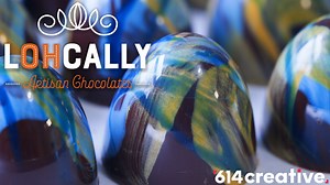 Chocolate comes in all sorts of flavors and form factors, from pure cacao to assorted fillings. Lohcally Artisan Chocolates is bringing their A-game with Feno De Aroma (The highest Chocolate standard in the World) chocolate molded into truffles and hand-painted with beautifully stunning detail. Learn more at https://614now.com/2024/food-drink/by-hand-new-columbus-chocolatier-offers-hand-painted-truffles-artisan-charm | 614