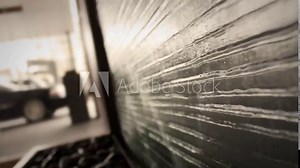 Water Fountain outside of modern hotel lobby entrance at sunset