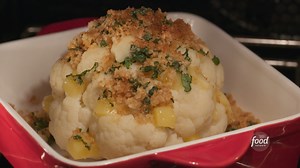 This WHOLE cauliflower is stuffed with cheddar cheese and topped with crunchy basil breadcrumbs 🤩 That's pure veggie magic if we've ever seen it, Giada De Laurentiis! Subscribe to discovery to stream full episodes of #GiadaEntertains: https://links.discoveryplus.com/wcMaaJ8qBgb. #discoveryplus Get the recipe: https://foodtv.com/3LacRLp | Food Network