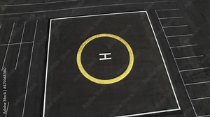 Helipad, aerial view. Black asphalt with markings for the helicopter landing zone.