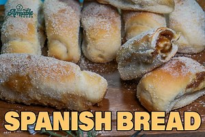 Spanish Bread is something that you should really try baking. These log-shaped bread with butter and sugar paste filling is truly hearty comfort food. Eating one is nostalgic and reminiscent of fond childhood memories! printable recipe: https://amiablefoods.com/spanish-bread/ | aMIAble foods