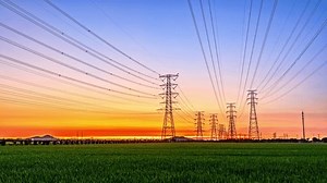 clip-1100126711-high-voltage-electric-towers-sunrise-transmission-power
