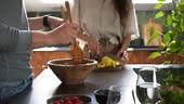 Couple preparing food together at kitchen