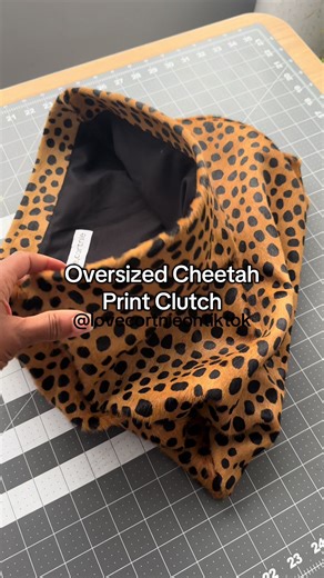 The Roll Down Clutch in cheetah printed calf hair has been a staple on the website for years now. Find it online!