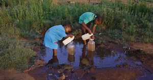 clip-1061394247-water-crisis-poverty-drought-two-young-black