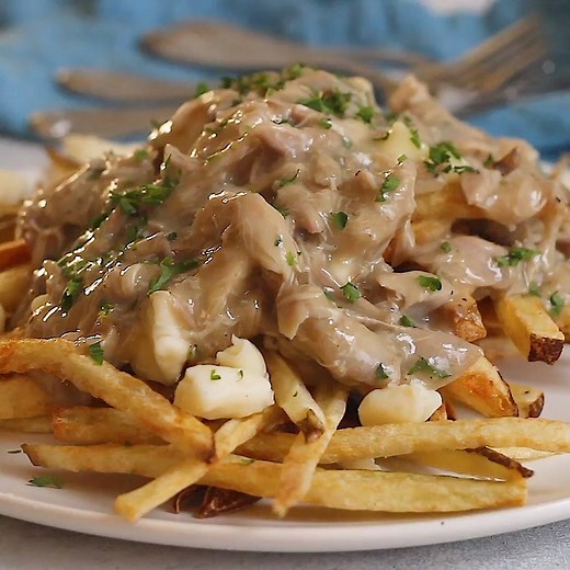 40K views · 120 reactions | One of my favorites, Chicken Poutine (fries smothered with gravy and melted cheese), is loaded with slowly cooked, seasoned and shredded chicken and cheese curds. Don't let the fancy name fool you, this Canadian dish is pure comfort food done right. Get the Recipe! >> https://keviniscooking.com/the-ultimate-chicken-poutine/ | Kevin Is Cooking | Facebook