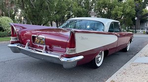 SOLD 1957 Chrysler Windsor 2 dr htp -Charles Phoenix Auto Sales -Spectacular, low-mileage, original black plate Southern California car with 50K original miles, always garaged, straight rust-free body, two-tone deep ruby red metallic and cream paint with complementary pink cloth and gold vinyl upholstery. Excellent chrome, pot metal, stainless and details inside and out. Optional factory tinted glass and scallop side trim. Powerful 354 “semi-hemi” V-8 with push-button 3-speed Torqueflite transmi