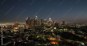 Los Angeles downtown aerial view. Nighttime downtown Los Angeles. Financial District, famous skyscrapers at night. Los Angeles City Hall. Skyscrapers in LA Financial District.