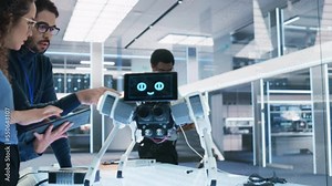 Robotics Engineer, Project Manager and Machinery Operator Collaborate on a Mobile Robot Project, Standing with Laptop Computer in Scientific Technology Lab. Young Team Developing an AI Robotic Dog.