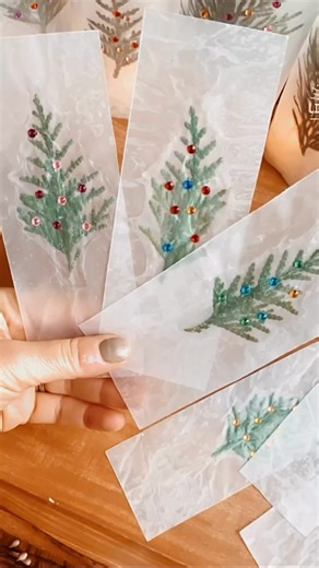 478K views · 1.8K reactions | •Wax Paper Bookmarks• They are so easy to make and the evergreen pieces make this the perfect holiday craft or handmade gift. They are so fun to make that you won’t be able to stop at one! The cutest vintage Christmas books from @cottagedoorpress  #bookmark #christmascrafts #christmascraftsforkids #raisingreaders #diybookmark #handmadegifts #handmadeholidays #diygifts #handmadedecor | Little Pine Learners | Facebook