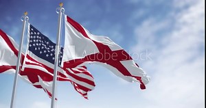 Flags of Alabama and the United States waving together