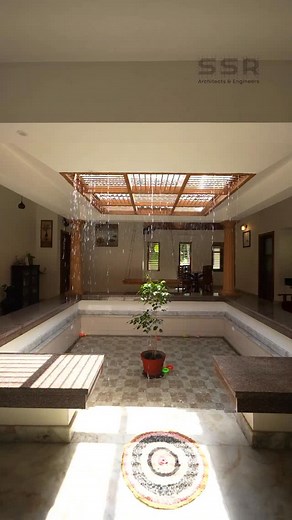 Location: Koyilandy Status: Completed on 2022 Architect : @ssrarchitects 📷 @jenseer_arch.photographer ‘Nalukettu’ The house around the courtyard. Step into serenity, where raindrops dance through the opening.This courtyard is a tranquil retreat, where natural light & gentle showers entwine to create a symphony of calm. | SSR Architects & Engineers