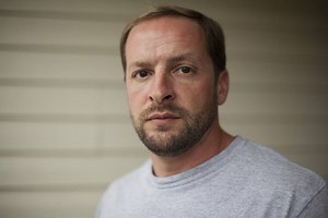 Marine who pissed on dead Taliban wins in court