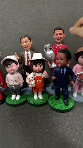 A cute handmade clay world full of nodding kids.
