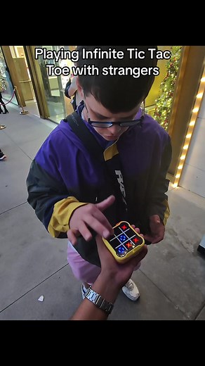 Playing Infinite Tic Tac Toe with Strangers