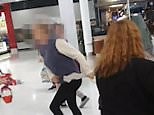 Shocking moment brawl breaks out in front of store full of shoppers