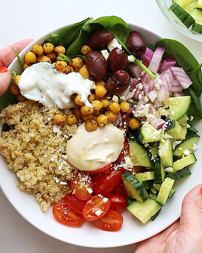 RECIPE --> https://www.eatingbirdfood.com/mediterranean-quinoa-bowl/(opens in a new tab) This mediterranean quinoa bowl combines quinoa, roasted chickpeas, spinach, red onion, kalamata olives and feta cheese all drizzled in a lemon dressing and tzatziki sauce. Great for meal prep! | Eating Bird Food
