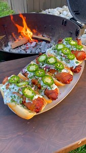 200K views · 2K reactions | Bacon Wrapped Chorizo Dogs 肋 #bacon #hotdogs #sunmergrilling | Over The Fire Cooking by Derek Wolf | Facebook