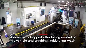 Video shows driver crash, flip over inside car wash