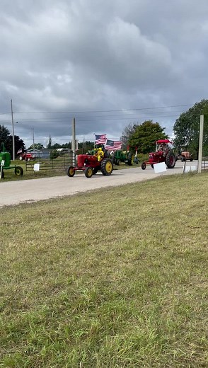Jackson Area Antique Tractor Club pulling into the staging area in Mackinaw City! | Mackinac Bridge Antique Tractor Crossing