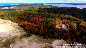 Amazing Fall Tour Of Ludington State Park and Big Sable Point Lighthouse Drone Footage 4K Video: https://youtu.be/LyrQHLBG7VI www.timelessaerialphotography.com Amazing Fall Tour Of Ludington State Park and Big Sable Point Lighthous Ludington State Park is a state park located just north of Ludington, Michigan between the shores of Lake Michigan and Hamlin Lake. The park encompasses nearly 5,300 acres (2,100 ha) and contains several ecosystems, including: forests, sand dunes, a dam, a Great Lake,