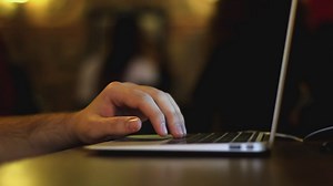 Hand of a man typing on a laptop - Free Stock Video