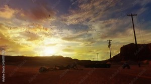 Crawling zombie stalker towards skeleton, dry and dying desert road at sunset, horrific scary scene with the living dead.