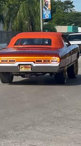Candy orange 71 Chevy Impala on gold 28’s Savinis riding