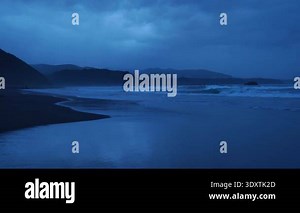Blue sand beach after sunset Stock Video Footage - Alamy