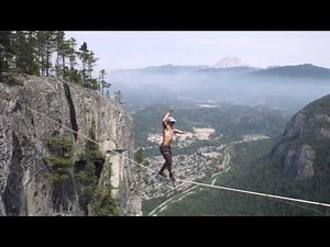 Daredevil walks 210 feet between cliffs for slackline record