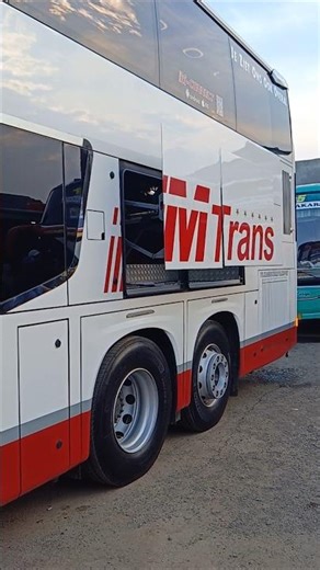 This big bus is parked in reverse The trunk automatically opens