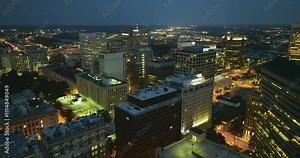 Downtown district of Richmond in Virginia, USA at night with brightly illuminated high skyscraper buildings. American travel destination