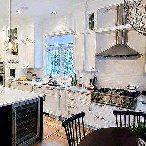 4.1K views · 19 reactions | From chocolate brown, to Chantilly Lace white, this stunning kitchen in the South Shore of Montreal feels so much more spacious! Having white cabinetry accentuates stainless appliances and acts as a neutral canvas for your cooking accessories. Get a quote for your kitchen revamp today! https://www.spray-net.com/residential-exterior-painting-services/kitchen-cabinet-painting-refinishing/ | Spray-Net | Facebook