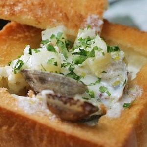 A hearty clam chowder full of clams, bacon, and potatoes deserves a crispy, absorbent fried bread bowl to eat afterward. | Tastemade