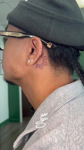 Fineline Filipino Sun behind-the-ear tattoo ☀️ Getting tatted before his trip back to motherland! #filipinotattooartist #bayareatattooartist #finelinetattoo #bayarea #filipino