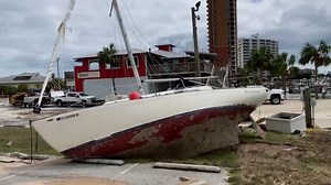 Hurricane Sally: Florida residents clean up after severe damage from storm