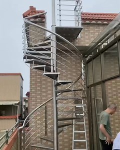 Rooftop Access Staircase: Safe, Sleek, and Built to Last This heavy-duty spiral staircase is engineered for easy rooftop access, with a focus on durability and modern design: ✅ Open wire railing (maintains unobstructed views of your surroundings) ✅ Anti-slip diamond plate steps (stable even in rain or dew) ✅ 100% stainless steel construction (corrosion-proof, 20 year lifespan) ✅ Customizable height & curve (fits any rooftop layout) ✅ Integrated landing platform (safe, stable transition to your r