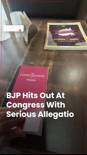 #WATCH | The BJP has accused the Congress party of distributing blank copies of the Constitution during an event led by Rahul Gandhi in Nagpur, Maharashtra. A video shared on social media, which quickly went viral, showed books labeled "Constitution of India" on the front, but containing only blank pages, except for the preamble on the first page. #BJP #Congress #RahulGandhi #Constitution #ABPLive | ABP Live