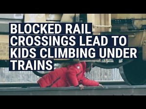Kids Have To Climb Over Parked Trains To Go To School